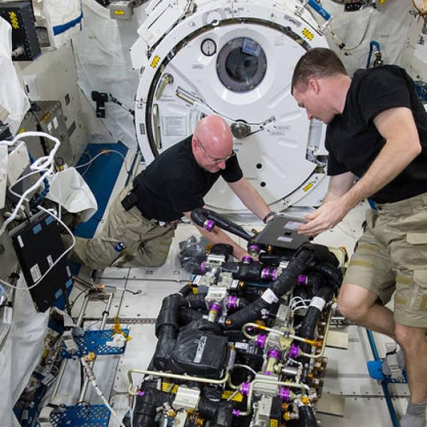 Astronauts carrying out experiments on the ISS