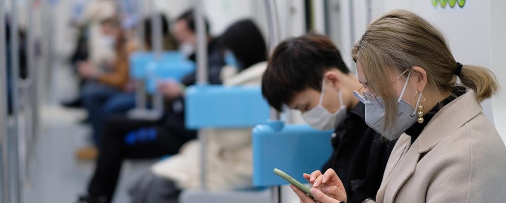 Masked people on train