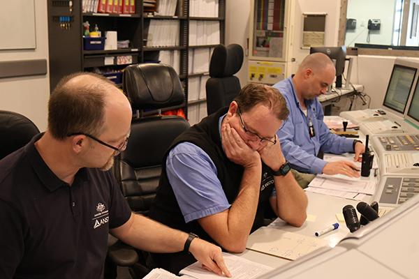 Shift manager and operators test first shutdown system in preparing to re-start the reactor